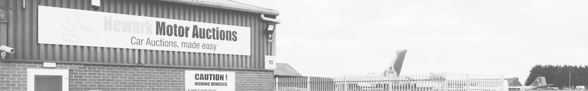 The outside of the auction hall itself with the Air Museum in the background